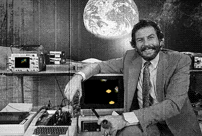 nolan bushnell at atari with old computers showing flying toasters screen savers